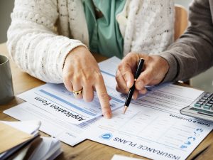 Pensioner filling out aform